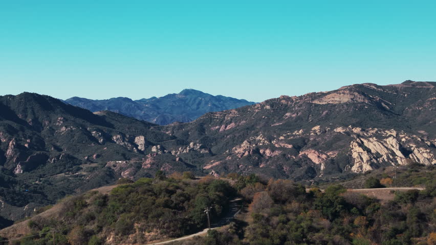 Drone wide view over hills and mountains in Santa Barbara County, California. Sunny day