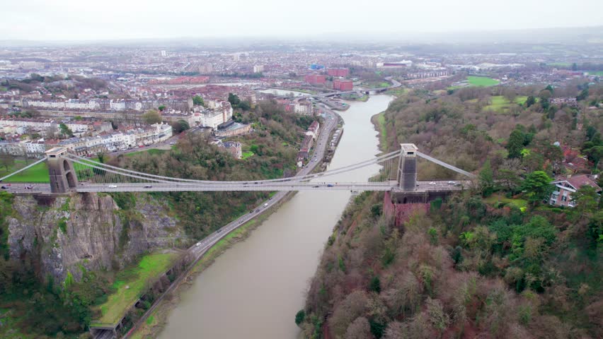Aerial view of the landmark of Bristol, flying over Clifton Suspension Bridge and Clifton Observatory. Overcast daytime