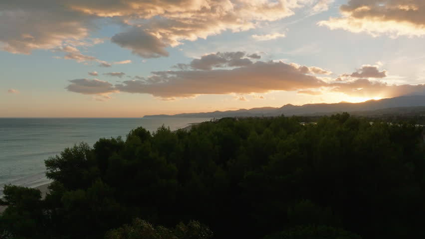 the landscape of a coastline at sunrise