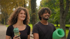 Indian male Caucasian female diverse couple outdoors high five fitness happy man woman after training workout in park together healthy lifestyle yoga exercise sport motivation partnership goal success - Powered by Shutterstock - Get 15% off with code: PIKWIZARD15