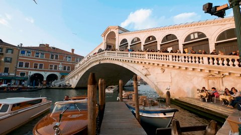 Rialto Bridge in Venice Italy at day, dolly shoot. People visiting bridge.