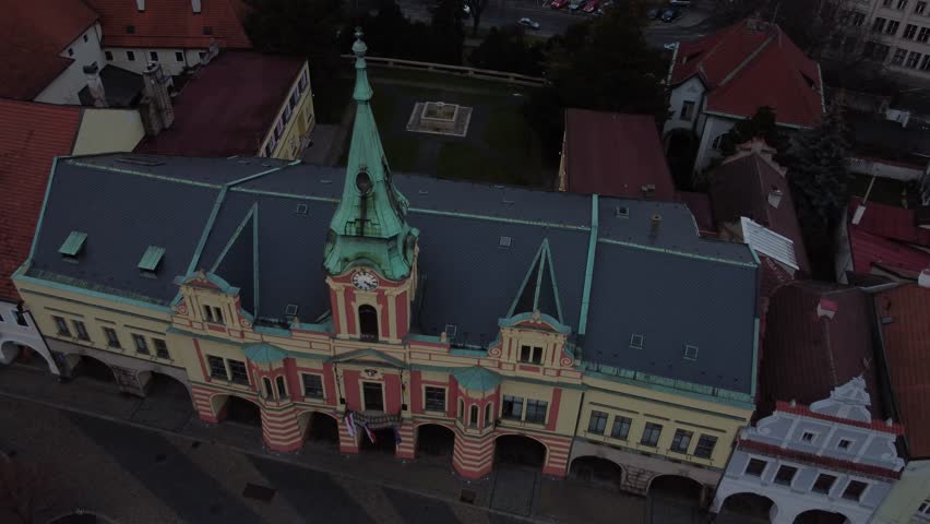 Historic building with columns and arched windows on street of Chezch