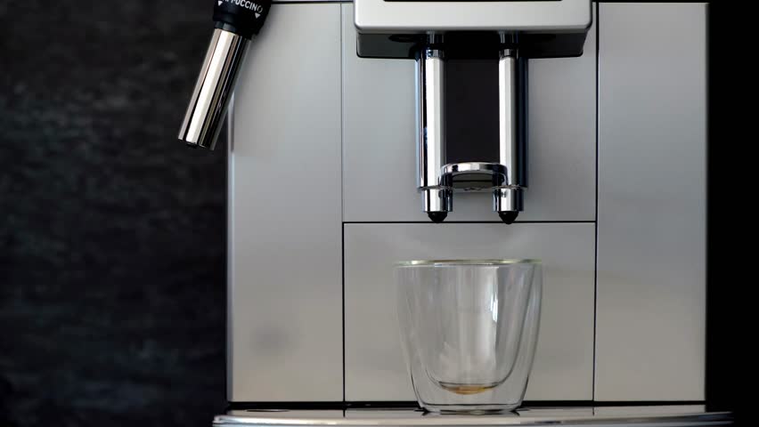 Modern coffee pouring machines often come with additional features to enhance the user experience. These may include programmable timers, allowing users to set the machine to start brewing at a specif Royalty-Free Stock Footage #3405087349