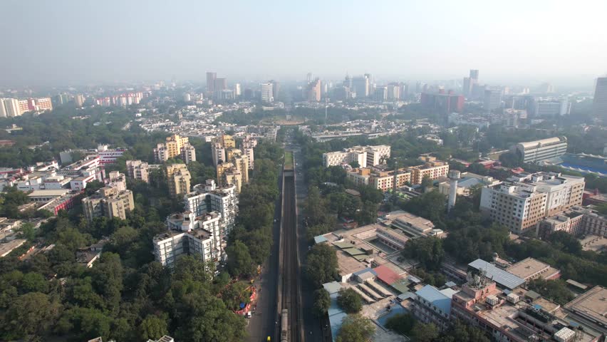 An Aerial shot of Delhi metro going in the underground Tunnel at Connaught Place in New Delhi, India
