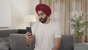 Sikh Indian man talking on video call