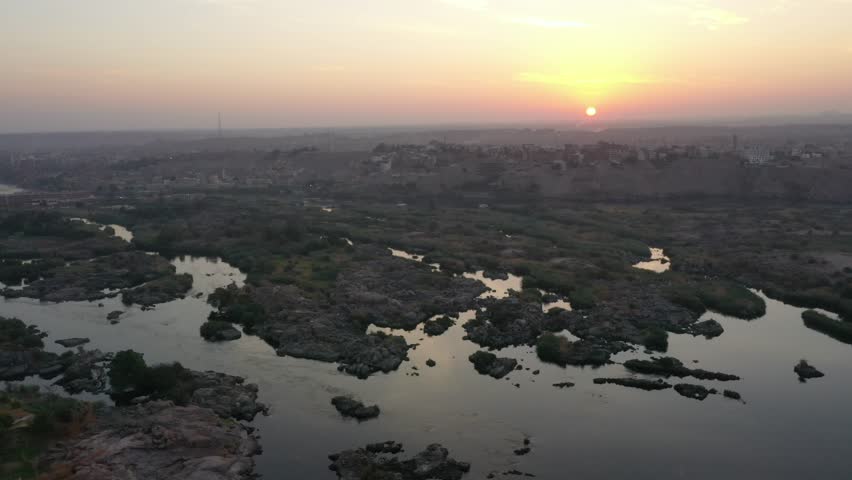 Cinematic Rare Aerial Drone Shot of Nile River in Aswan with Rock Islands Royalty-Free Stock Footage #3405175561