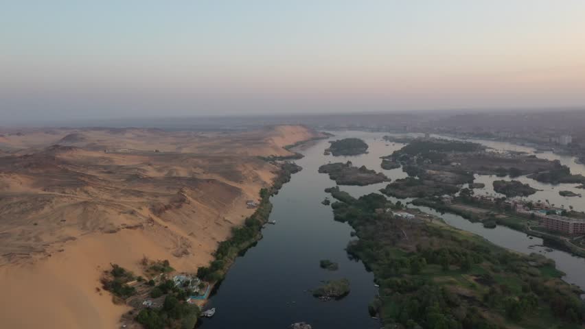 Scenic Aerial Drone shot of Nile River and West Bank and Desert in Aswan, Egypt Royalty-Free Stock Footage #3405175707
