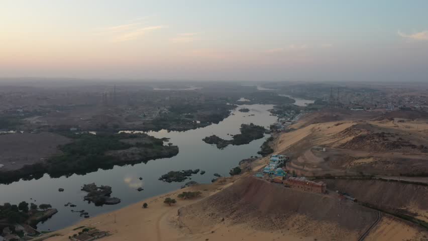 Rare Aerial Panning Drone Shot of Aswan and Nile River at Sunrise Royalty-Free Stock Footage #3405175781
