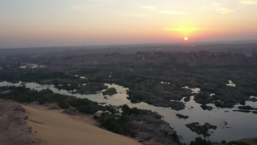 Rare Aerial Sunrise Zoom out shot of Aswan and Nile River and Valley