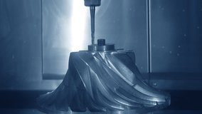 Demonstration of work of CNC milling machine drilling metal part, example of drilling metal blades of centrifugal turbocharger impeller in metalworking industry workshop - Powered by Shutterstock - Get 15% off with code: PIKWIZARD15