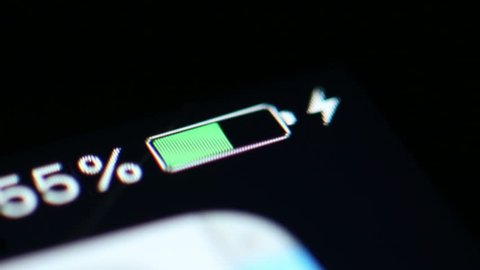 Time Lapse: A Smartphone Battery Is Charged From Zero to 100%. Close up macro shot of the battery level indicator on a smart phone being charged in time lapse.