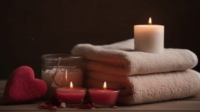 Valentines day romantic scenery with heart and aromatic candles. Relaxing  candles spa and wellness background. Love atmosphere mood backdrop. Massage studio therapy preparation. - Powered by Shutterstock - Get 15% off with code: PIKWIZARD15