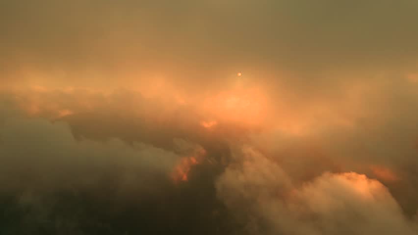 Aerial view on Cloud of smoke from a fire on sunset