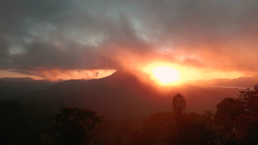 Aerial view of Sunrise over the clouds epic and amazing sky on volcano.