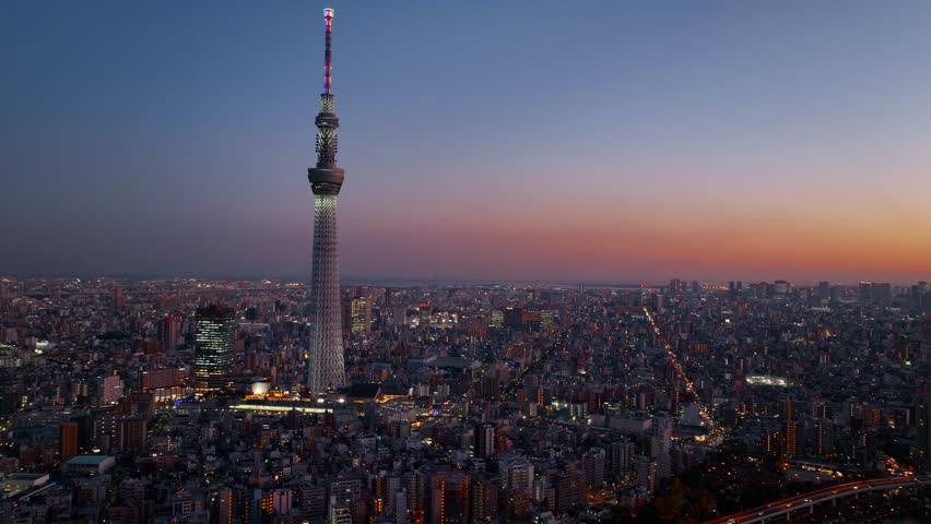 Tokyo skyline at night, aerial view of Tokyo Skytree and illuminated streets in downtown Tokyo at night, tourism in Japan, evening in Japanese capital. High quality 4k footage