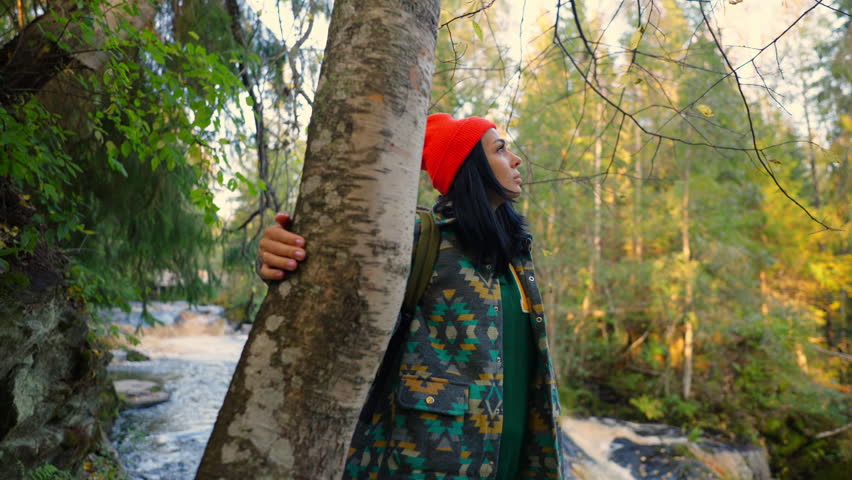 Young Adult Woman Resting And Relaxing In Forest, Admiring Beauty Of Nature, Portrait Of Traveler