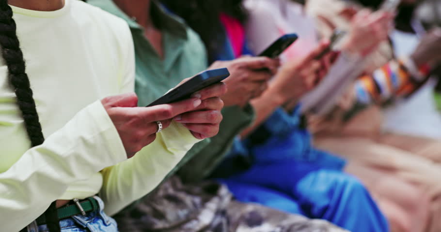 Hands, phone or group of friends in city on social media to chat on internet post or web notification. People, closeup or influencers on mobile app for texting, networking or typing online in town