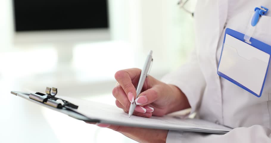 Doctor writing on medical documents with ballpoint pen in clinic closeup 4k movie slow motion. Maintaining medical records concept Royalty-Free Stock Footage #3405704585