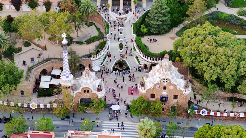Aerial drone view of Park Guell. Antoni Gaudi architecture. A lot of greenery around, tourists, Barcelona, Spain Royalty-Free Stock Footage #3405709869