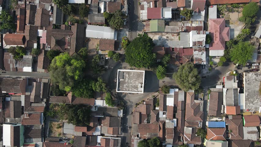aerial view, Kandang Menjangan or Panggung Krapyak, which is part of the imaginary axis of the Yogyakarta Palace, looks dashing with white walls between the residents' houses. Royalty-Free Stock Footage #3405788711