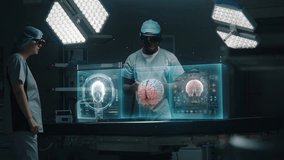 Diverse surgeons in AR headsets work in operating room. African American specialist uses AI virtual holographic display. 3D graphics of health monitors and human brain. Modern medical facilities. - Powered by Shutterstock - Get 15% off with code: PIKWIZARD15