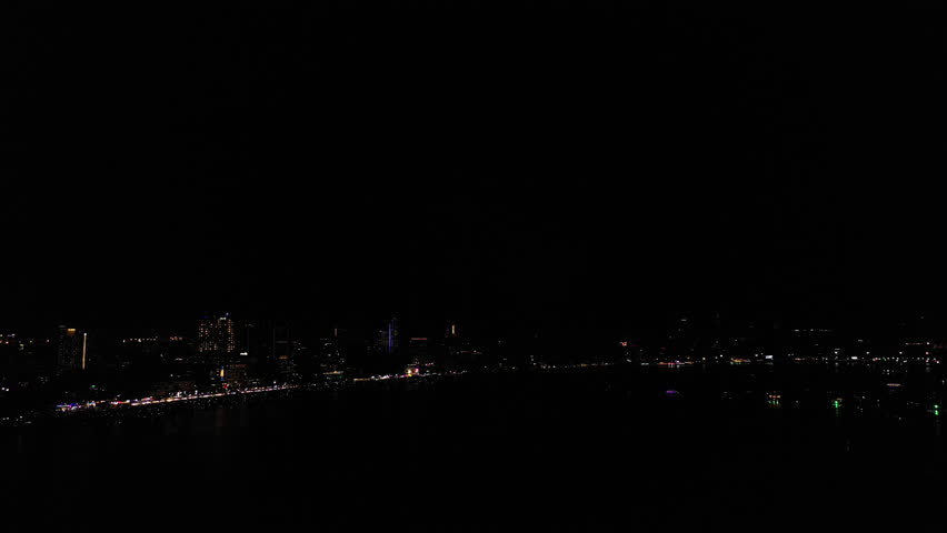 Aerial top view of Celebration day. Skyline with fireworks light up sky over landmark skyscraper on the sea in Pattaya International Fireworks Festival, Thailand. Holidays, celebrating New year.