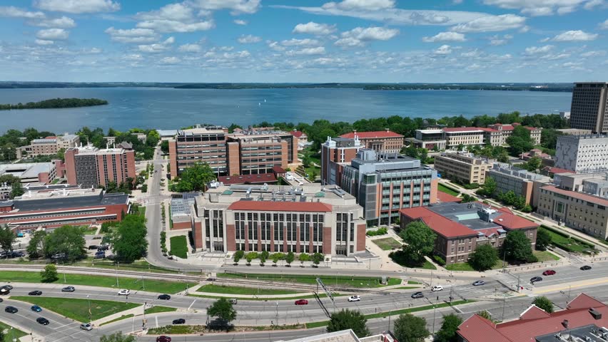 University of Wisconsin campus with Lake Mendota in the background on beautiful summer day. Aerial.