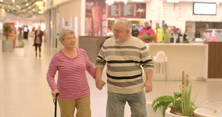 Happy Senior couple celebrating Valentine's Day. Portrait of people falling in love. Senior couple can enjoy each other company in relaxed and comfortable setting. Mature adults walking in real life. Royalty-Free Stock Footage #3406149253