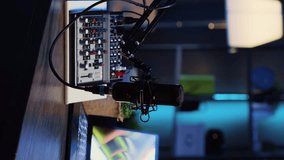 Vertical video Panning shot of podcast microphone used to record discussions for internet livestreaming channel and 3D renders running on notebook screen. High tech streaming sound capturing and - Powered by Shutterstock - Get 15% off with code: PIKWIZARD15