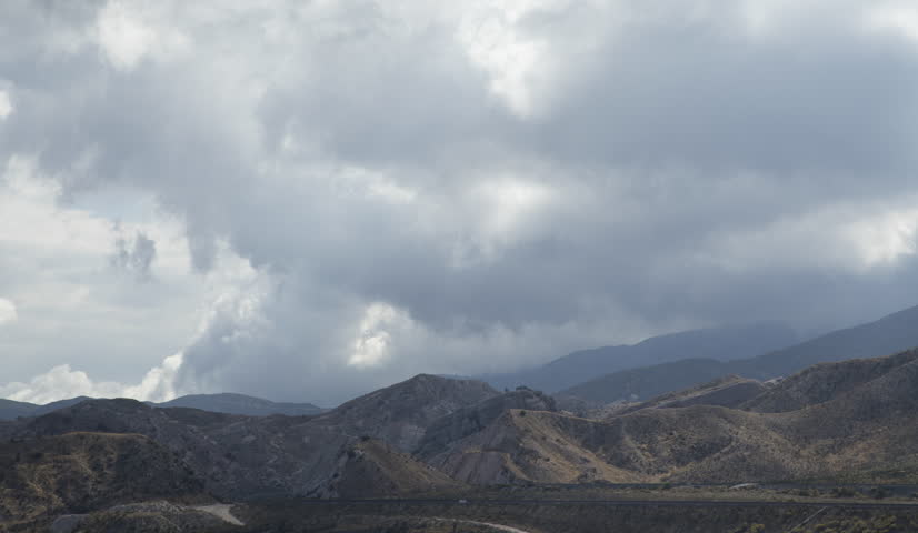 Time lapse of freight trains under stormy skies 4k 24fps