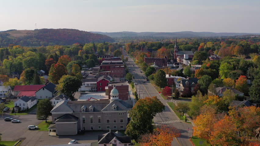 Aerial view of Fall (Autumn) foliage around a small town in New York state.