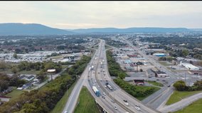 Aerial view of \view of Interstate 75 in Chattanooga a hyperlapse video as the clouds pass over the city shot from a drone. at the foot of the ridgecut. 