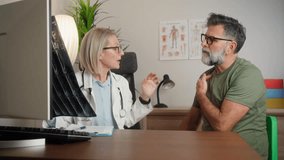 Female doctor showing to male senior patient an x-ray of the spine and neck. medicine, healthcare and people concept - smiling doctor showing x-ray to patient at medical office in hospital - Powered by Shutterstock - Get 15% off with code: PIKWIZARD15