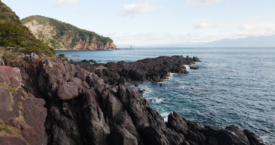 A seascape of rocky outcrops formed by flowing lava.