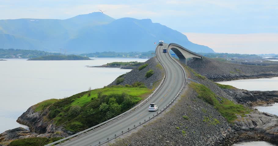 Traffic on Atlantic Ocean Road or the Atlantic Road (Atlanterhavsveien) was awarded the title as (Norwegian Construction of the Century). Royalty-Free Stock Footage #3406473397