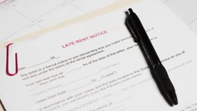 Late rent notice document form on table - Powered by Shutterstock - Get 15% off with code: PIKWIZARD15
