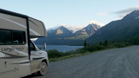 Carcross, Canada - 07-21-2017 - Dusty RV Camper Truck Driving Away On Alaska Highway Yukon Canada