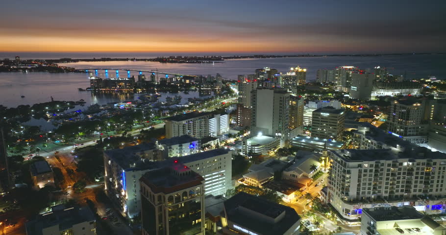 Sarasota, Florida city downtown at night with expensive waterfront high-rise buildings. Urban travel destination in the USA. Royalty-Free Stock Footage #3406683121