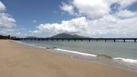 Lucinda service jetty, a sugar cane export jetty, the longest in the Southern Hemisphere, at the town of Lucinda in tropical Queensland, Australia. Hinchinbrook Island is in the background.