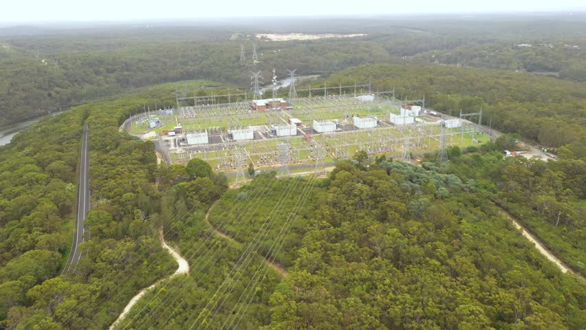 Aerial drone view of a large electrical distribution substation for the generation and supply of energy to households and industry located at Picnic Point in Sydney, NSW Australia  