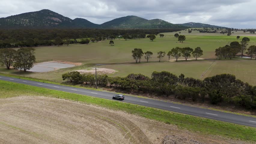 The You Yangs Regional Park is a park in southern central Victoria, Australia. Wide drone shos of the mountins. 