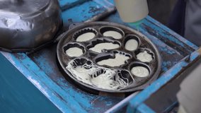 process of making spider cake or kue laba-laba, 4K video of street indonesian food