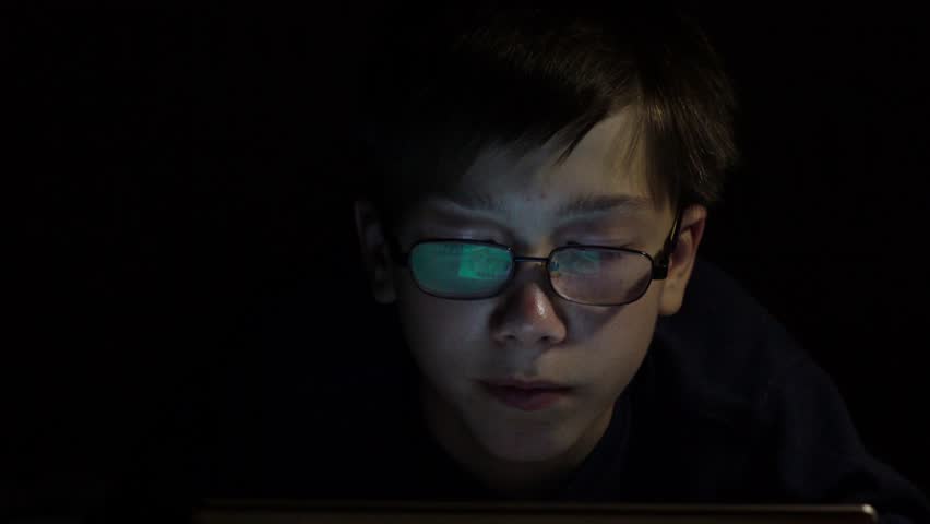 boy's face looking monitor dark room Stock Footage Video (100% Royalty ...