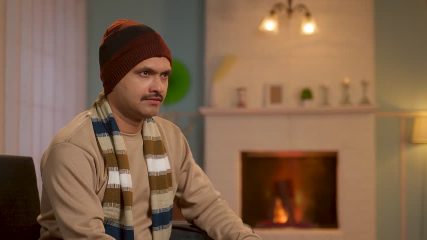 Middle aged happy relaxed man in winter wear looking at camera - concept of leisure lifestyle, tranquility and peaceful evening