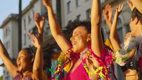 Carnival Celebration: Friends Dancing in the Streets During Festive Brazilian Party, Colorful Costumes and Joyful Expressions in Urban Brazil. - Powered by Shutterstock - Get 15% off with code: PIKWIZARD15