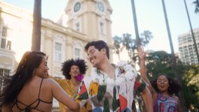 Vibrant Street Dance at Brazilian Carnival, Joyous Group Embracing Festive Spirits. Couple and Friends Celebrating in Colorful Costumes Amidst Urban Backdrop. - Powered by Shutterstock - Get 15% off with code: PIKWIZARD15