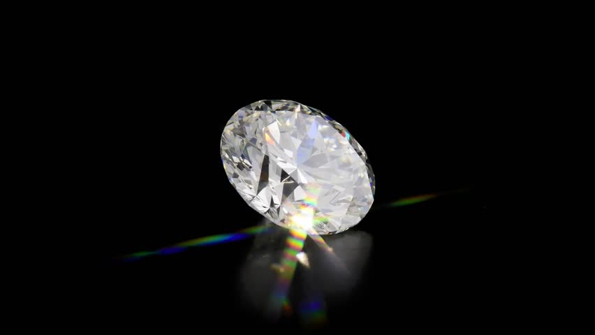 Round cut diamond stone, black background, sparkling in the light