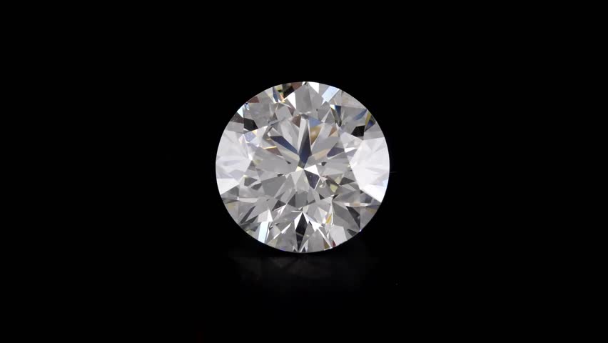 Round cut diamond stone, black background, sparkling in the light