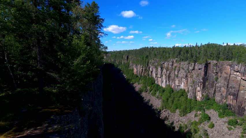 Ouimet Canyon, partly in shadow, in Northern Ontario, Canada.