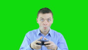 Young man playing video games and holding remote controller